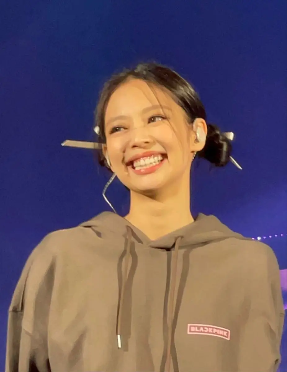 Person wearing a brown hoodie.